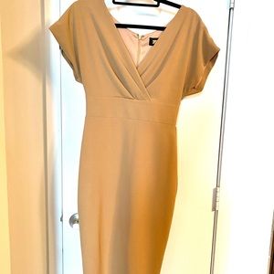Fully lined light tan dress.